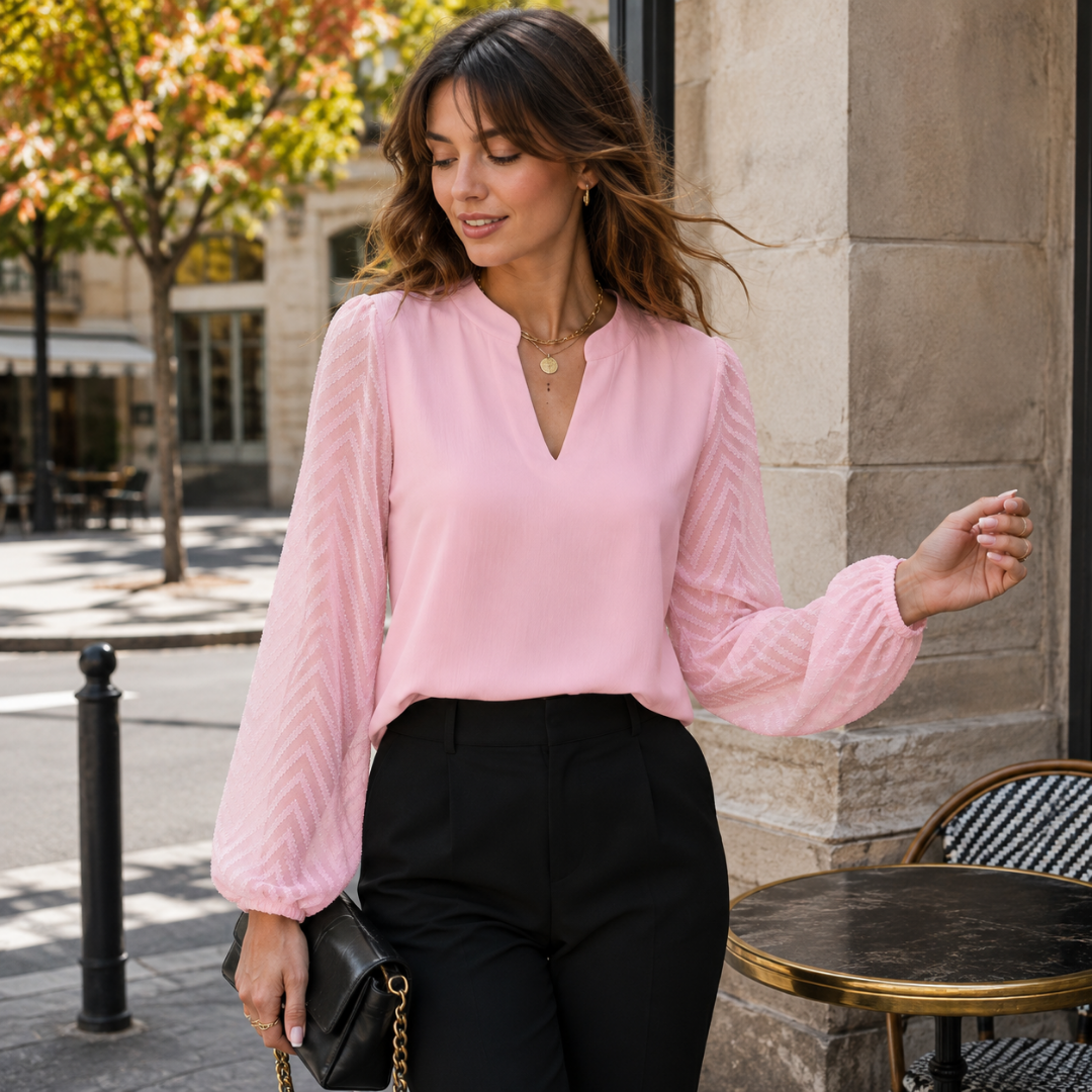 Camicetta rosa con scollo a V e maniche lunghe traforate a chevron