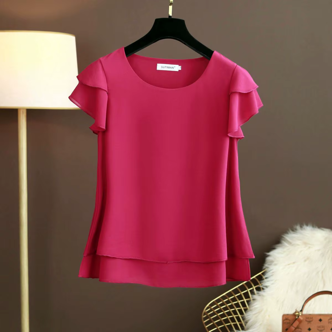Camicetta donna fucsia con girocollo e volant sulle spalle, vista frontale