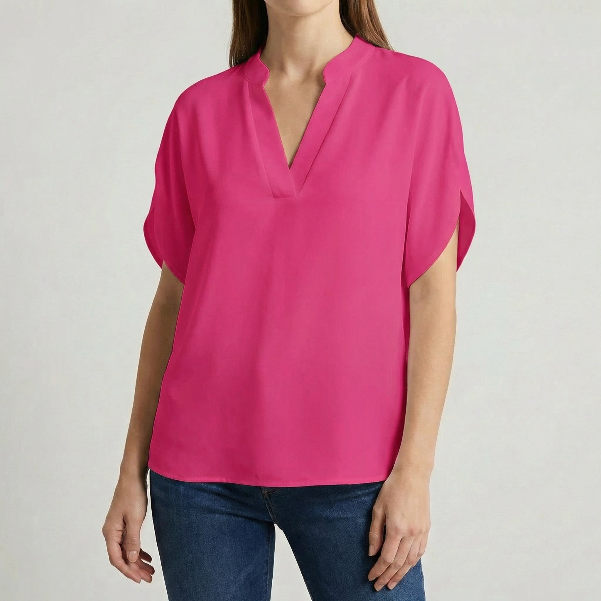 Camicetta fucsia donna con scollo a V, linea oversize e orlo curvo