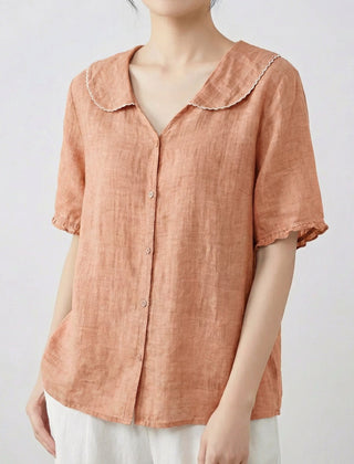 Camicia donna albicocca con volant ai polsini e chiusura frontale con bottoni chiari