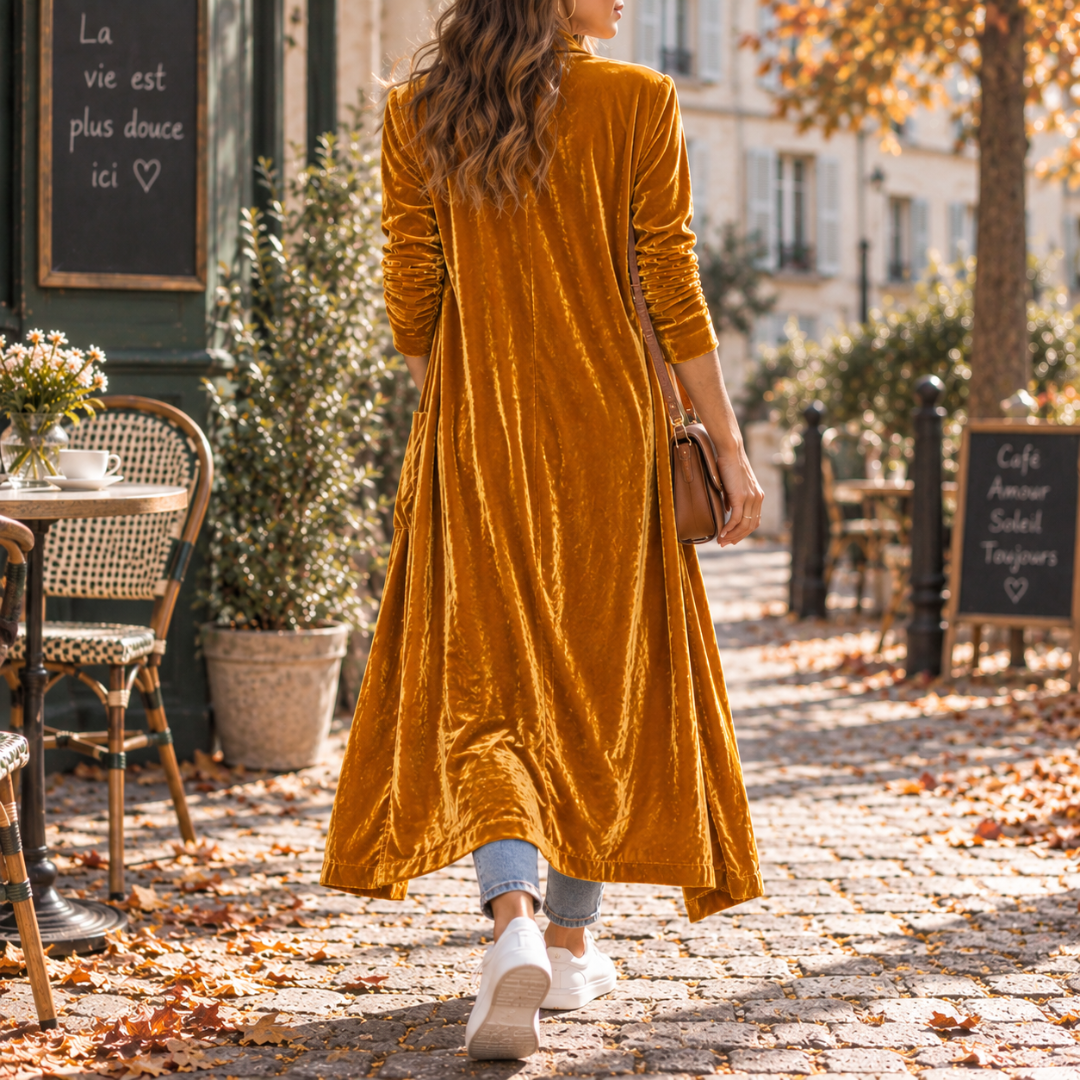 Retro del cardigan lungo arancione con linea ampia che sfiora la caviglia