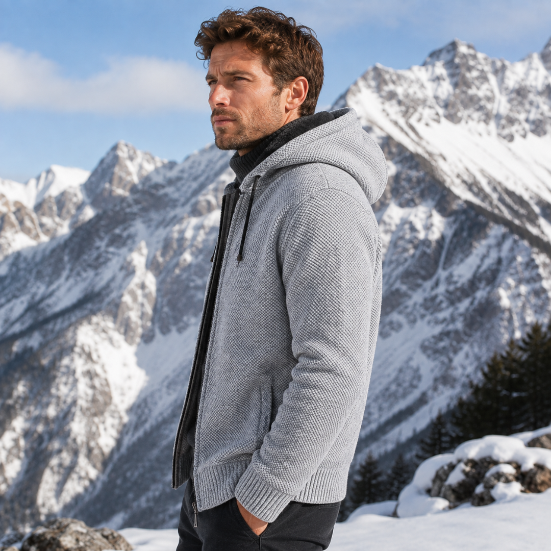 Vista laterale del cardigan grigio chiaro con cappuccio, lacci coulisse e polsini a coste