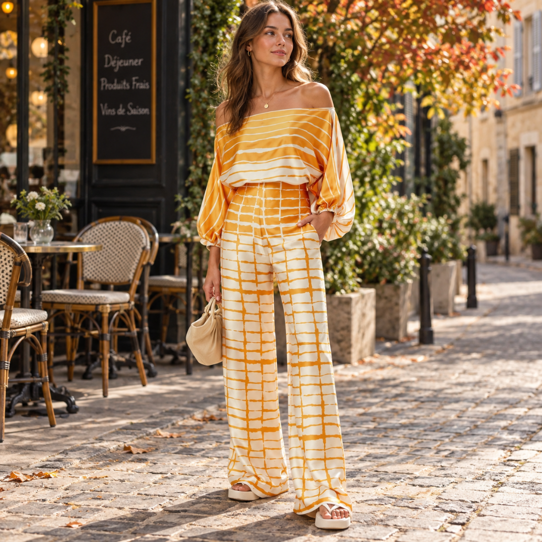 Completo arancione a righe con top ampio e pantaloni fantasia a gamba larga