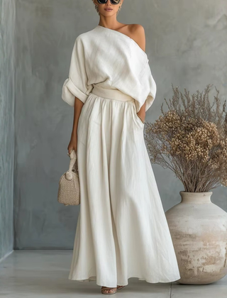 Completo donna bianco con top a spalla scoperta e pantaloni ampi con vita arricciata