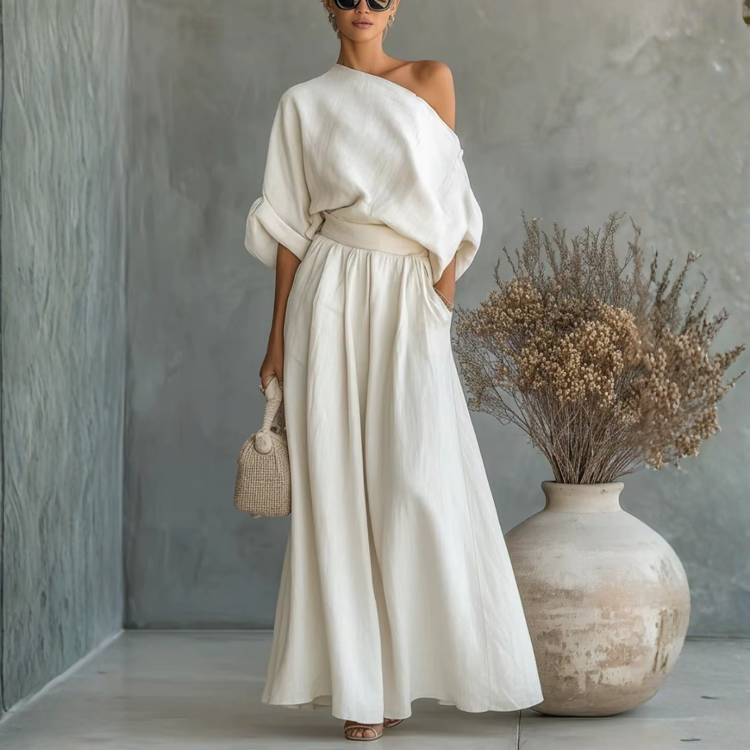 Completo donna bianco con top a spalla scoperta e pantaloni ampi con vita arricciata