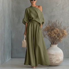 Completo donna verde scuro con top asimmetrico e pantaloni palazzo con tasche