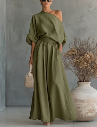 Completo donna verde scuro con top asimmetrico e pantaloni palazzo con tasche