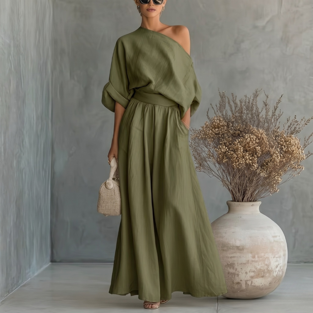 Completo donna verde scuro con top asimmetrico e pantaloni palazzo con tasche
