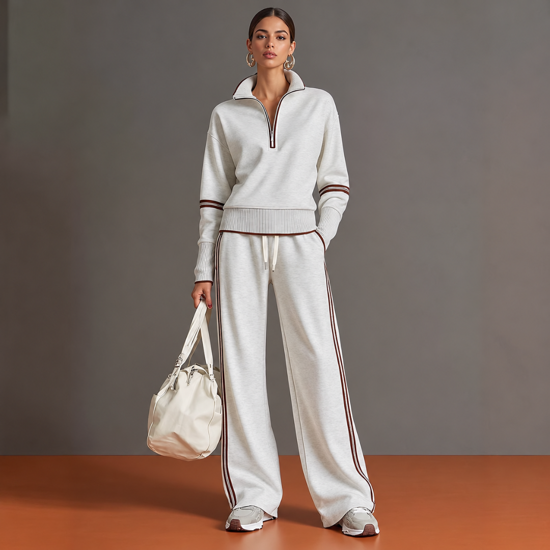 Completo donna bianco in maglia con mezza zip e pantaloni larghi a righe