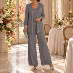 Completo grigio scuro con giacca a paillettes e pantaloni fluidi