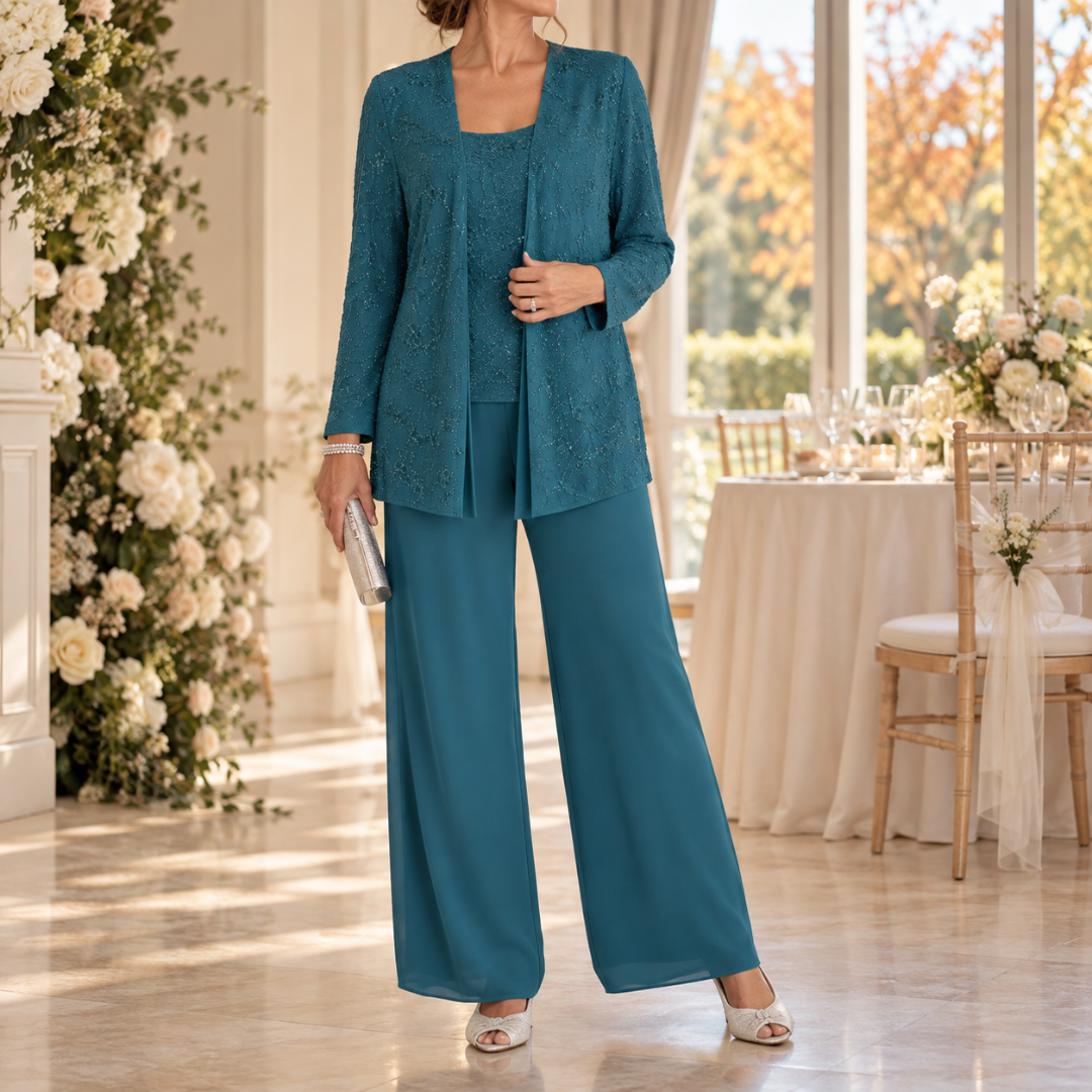 Completo verde pavone con giacca traforata e pantaloni fluidi da cerimonia