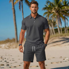 Completo uomo grigio scuro con polo a due bottoni e shorts con coulisse bianca