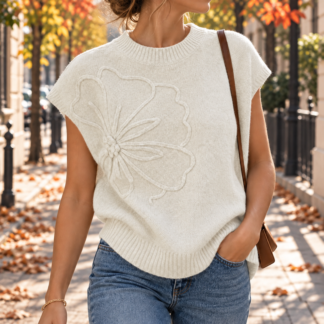 Gilet bianco in maglia con fiore in rilievo e girocollo a coste
