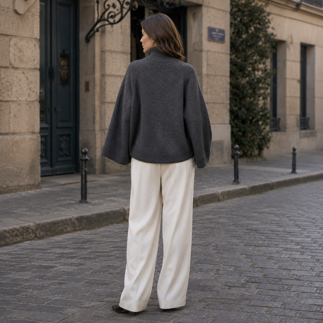 Retro del maglione grigio scuro donna con collo alto e linea corta