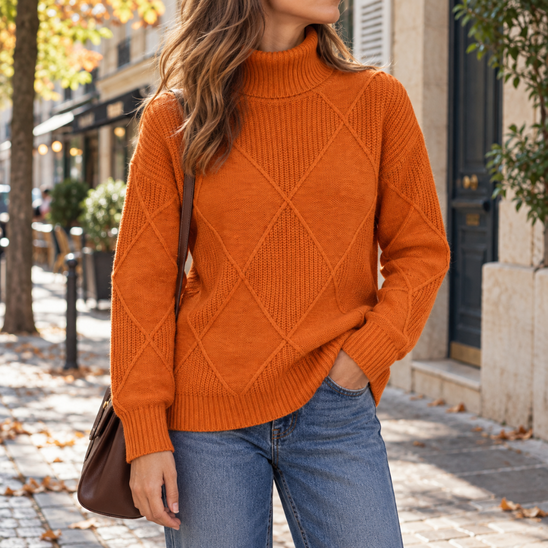 Maglione arancione dolcevita con lavorazione a rombi e orlo arrotondato