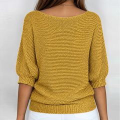 Retro del maglione giallo senape in maglia a trama larga con scollo ampio