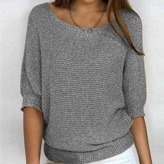 Maglione donna grigio in maglia a trama larga con scollo ampio e polsini a coste