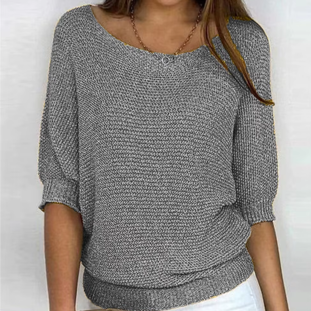 Maglione donna grigio in maglia a trama larga con scollo ampio e polsini a coste