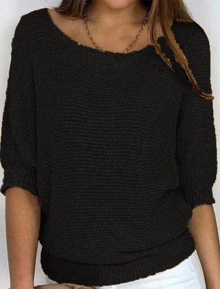 Maglione donna nero in maglia a trama larga con polsini e bordo a coste
