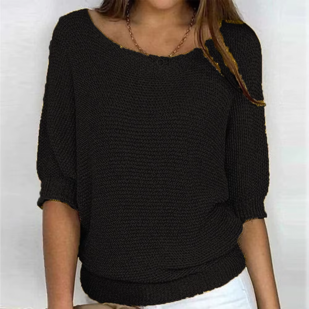 Maglione donna nero in maglia a trama larga con polsini e bordo a coste