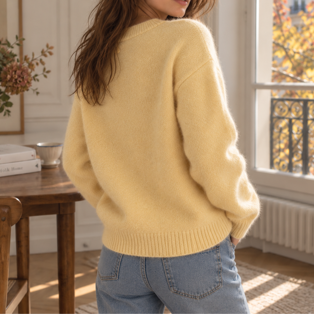 Retro del maglione giallo oversize con bordo inferiore a coste e spalle scese