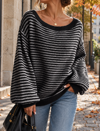 Maglione donna nero a righe bianche con maniche lunghe a palloncino