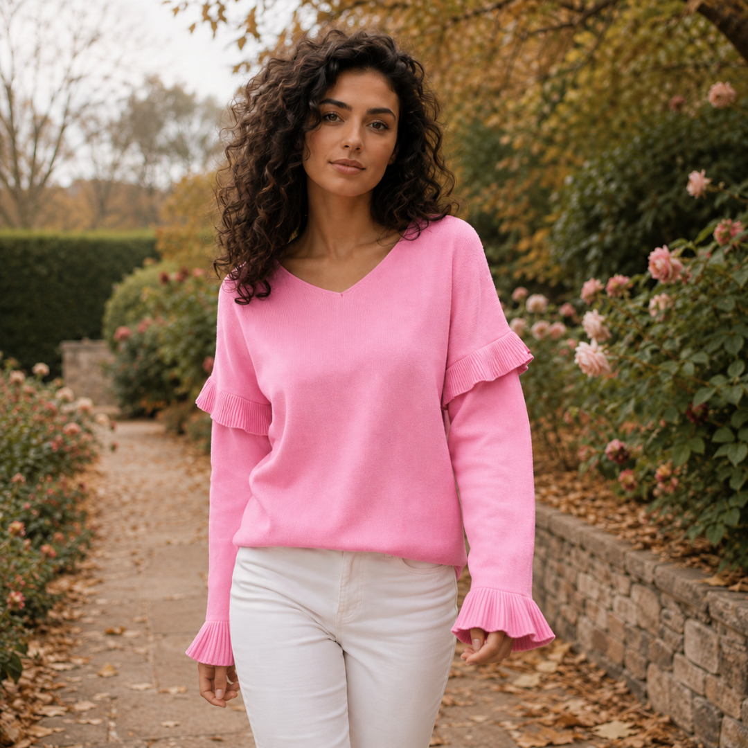 Maglione donna rosa a scollo a V con volant sulle spalle e polsini svasati