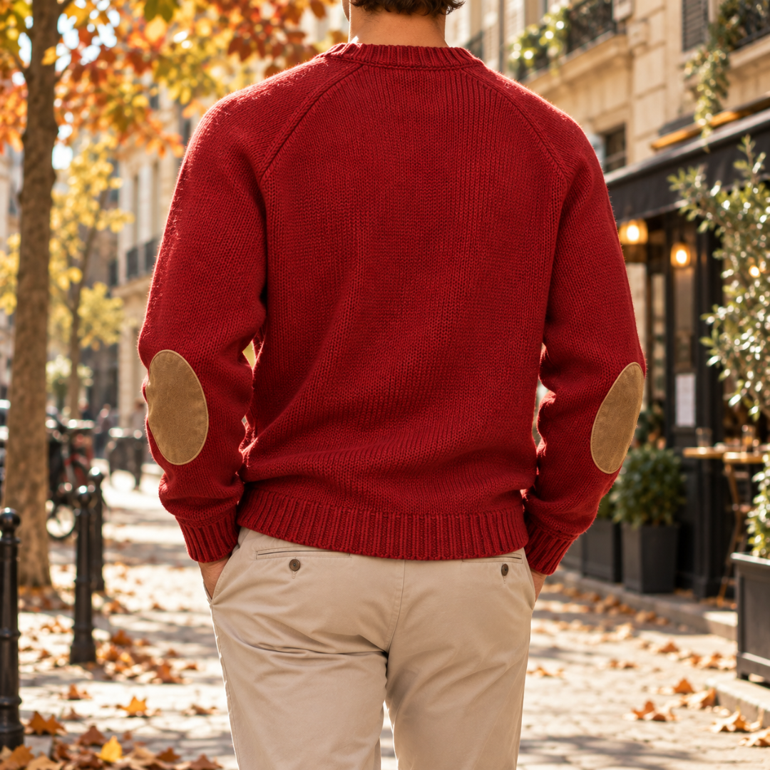 Retro del maglione rosso con toppe ovali sui gomiti e fondo a coste