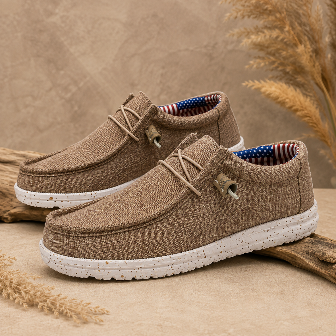 Mocassini uomo marroni slip-on con lacci elastici e suola bianca screziata