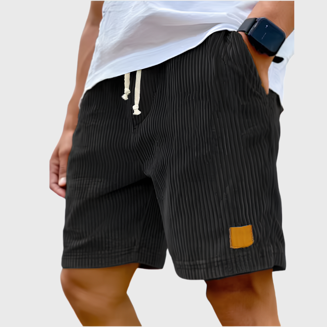 Pantaloncini uomo neri a coste con laccetti chiari ed etichetta gialla laterale