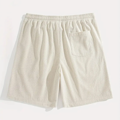 Retro dei pantaloncini uomo beige con tasca posteriore applicata e vita elastica