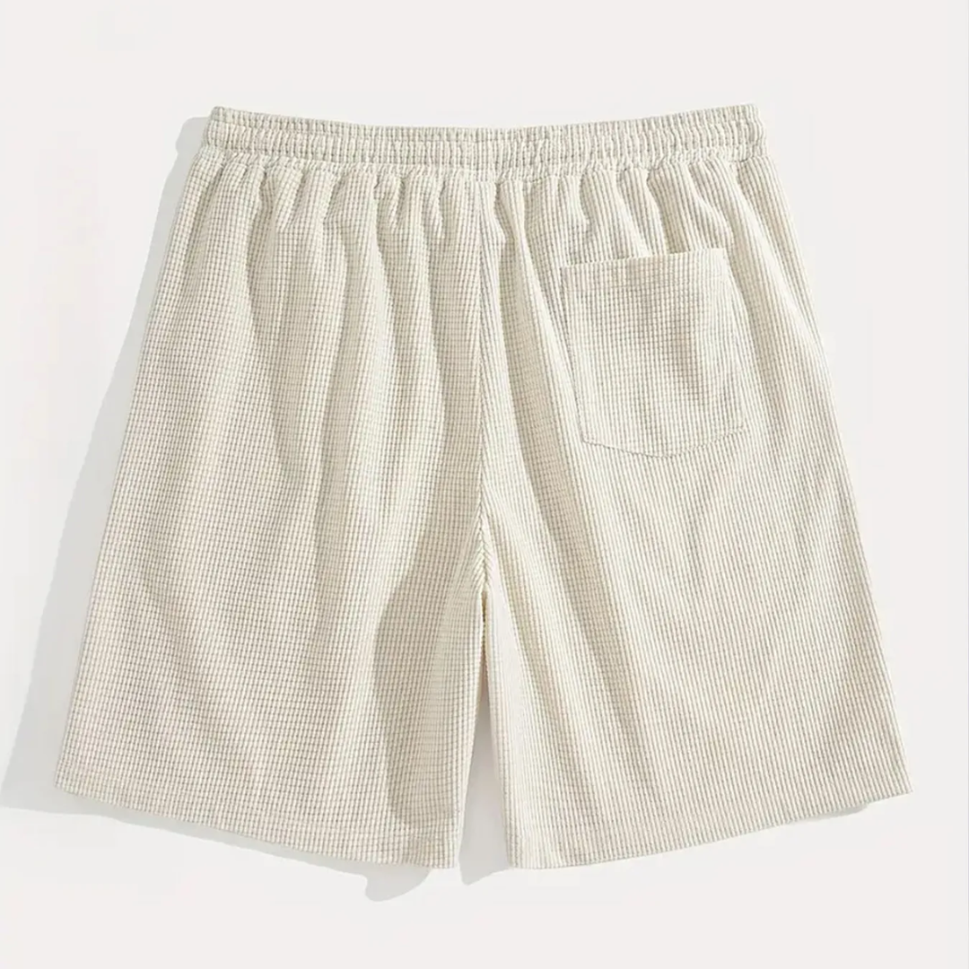 Retro dei pantaloncini uomo beige con tasca posteriore applicata e vita elastica