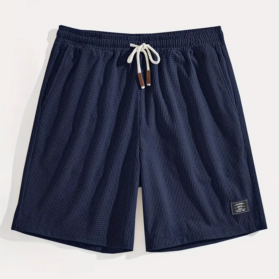 Pantaloncini blu navy distesi con coulisse bianca e texture a nido d'ape