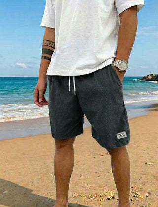 Pantaloncini uomo grigio scuro a coste con laccio in contrasto e vestibilità rilassata