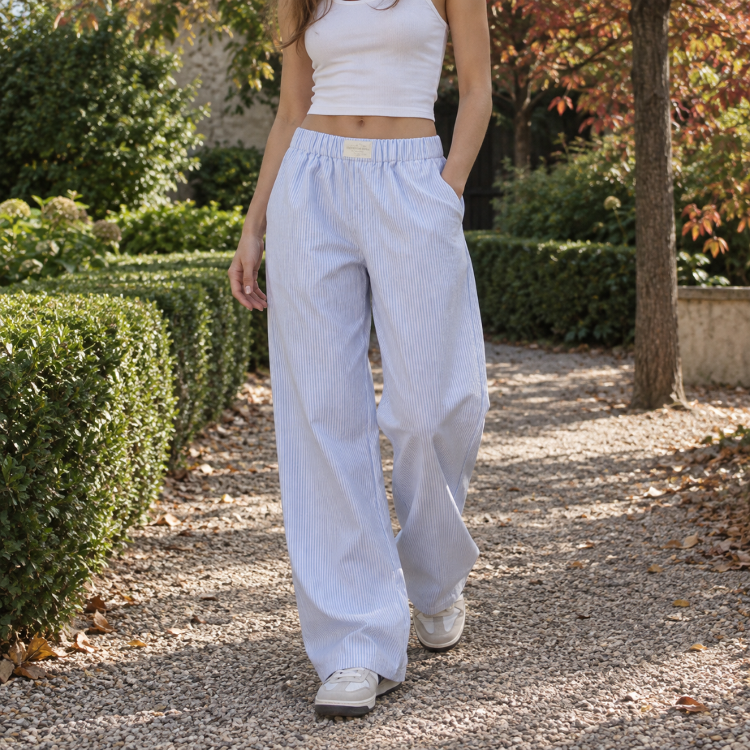 Pantaloni donna blu a righe sottili con vita elastica e gamba larga