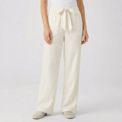 Pantaloni beige chiaro a gamba larga con cintura in coulisse annodata