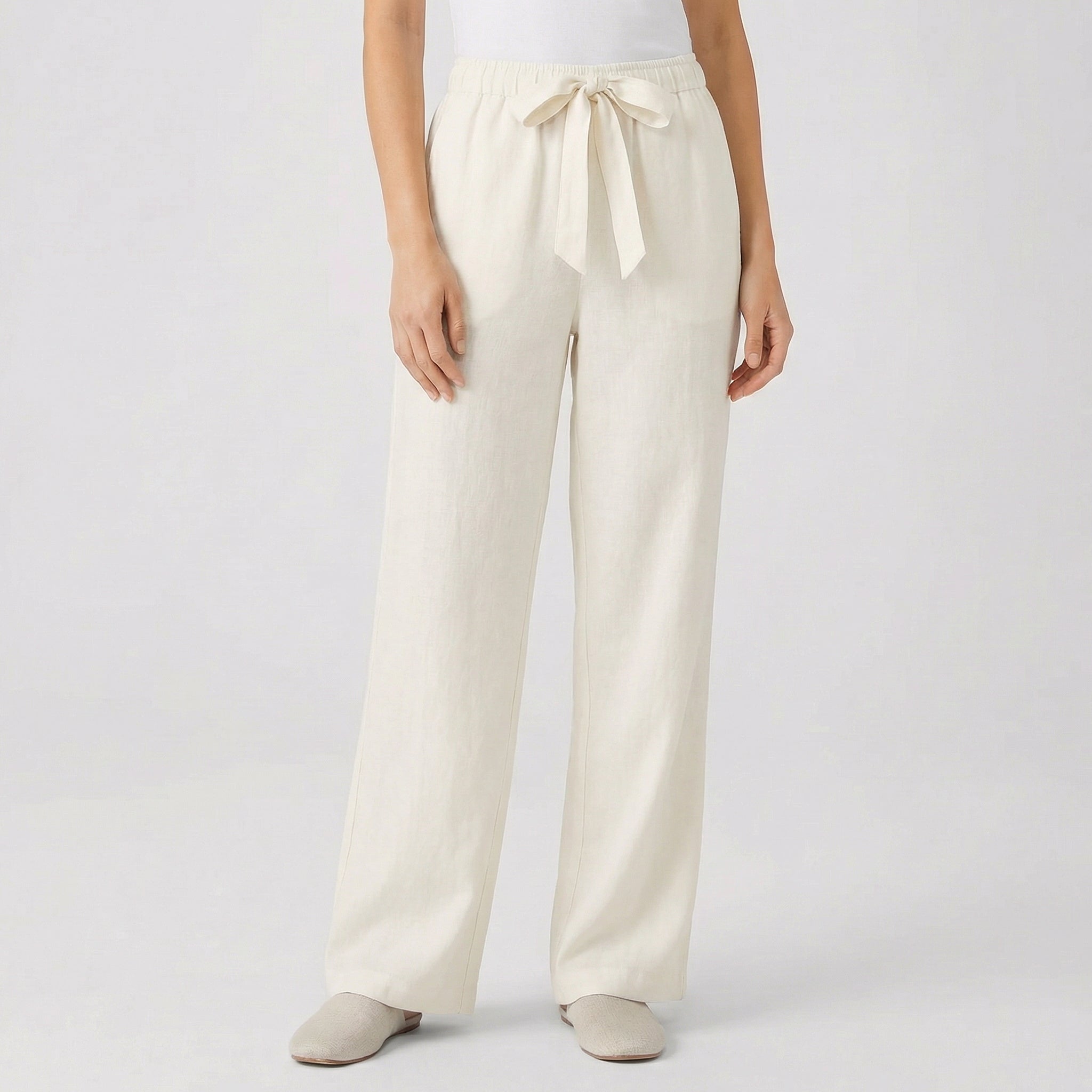 Pantaloni beige chiaro a gamba larga con cintura in coulisse annodata