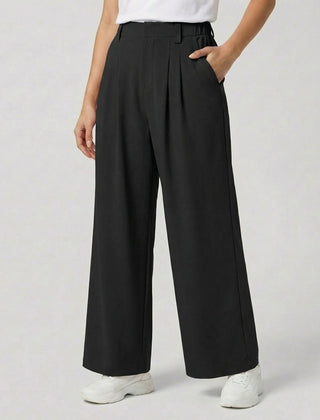 Pantaloni donna neri palazzo con pieghe morbide, tasche laterali e orlo ampio