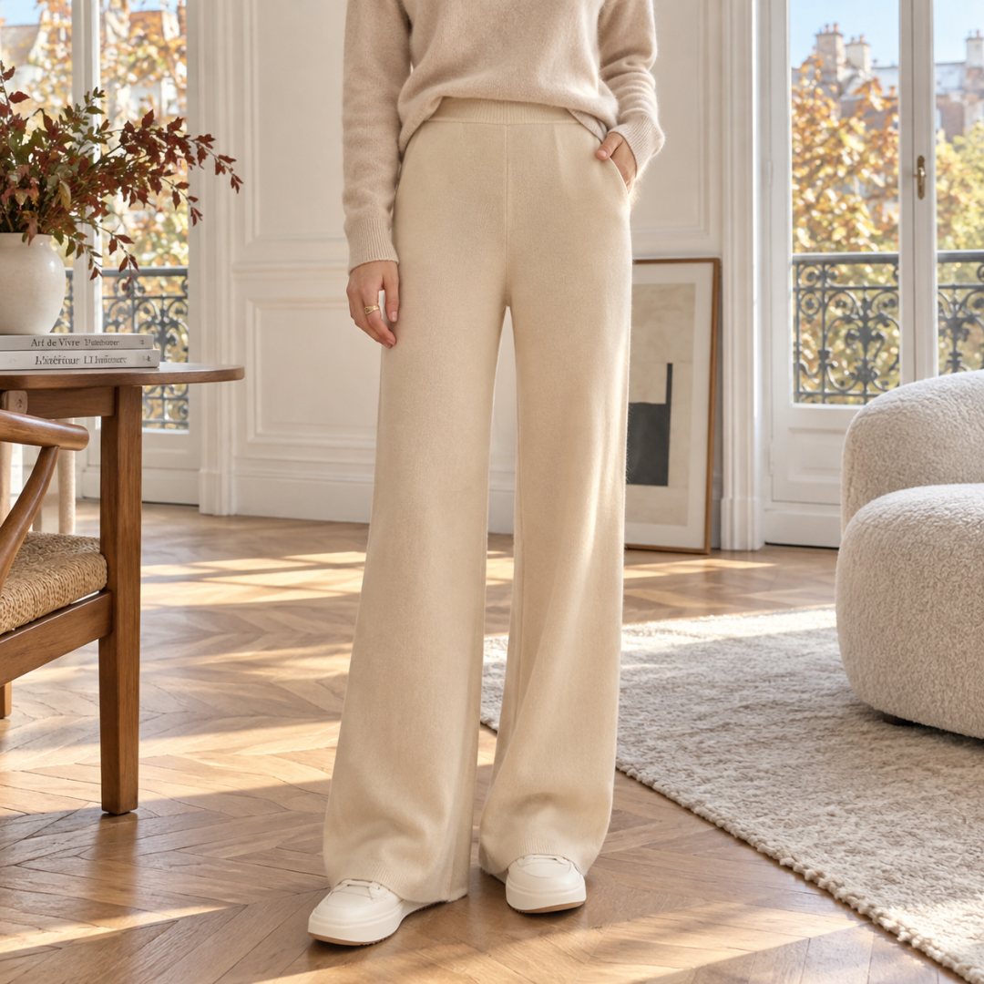 Pantaloni beige a gamba larga con vita alta e fondo rifinito a coste