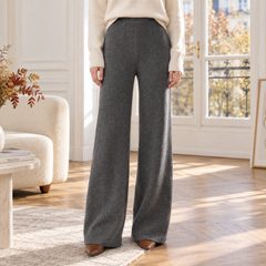 Pantaloni grigi a gamba larga con vita alta e caduta lunga fino al pavimento
