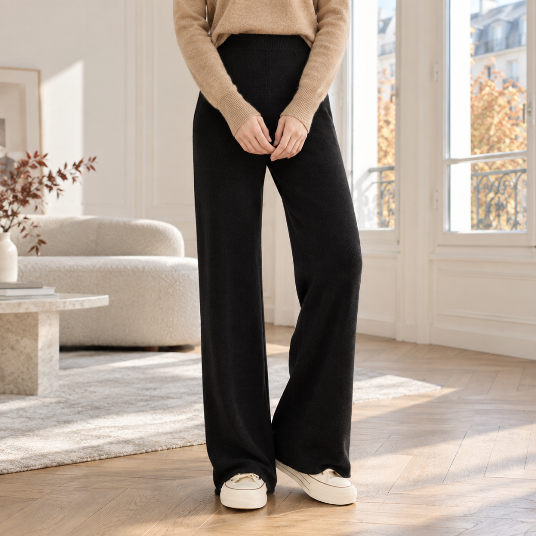 Pantaloni neri a gamba larga in maglia con vita alta e fondo a coste