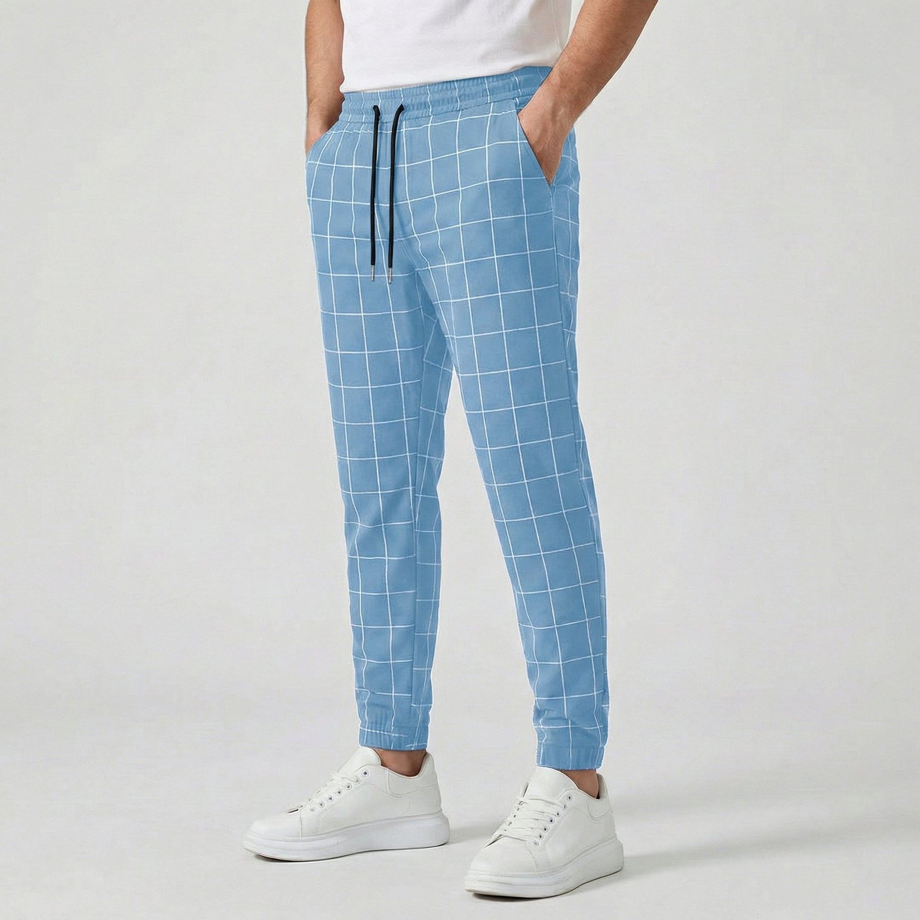 Pantaloni jogger uomo azzurri a quadri bianchi con vita elastica e caviglia stretta