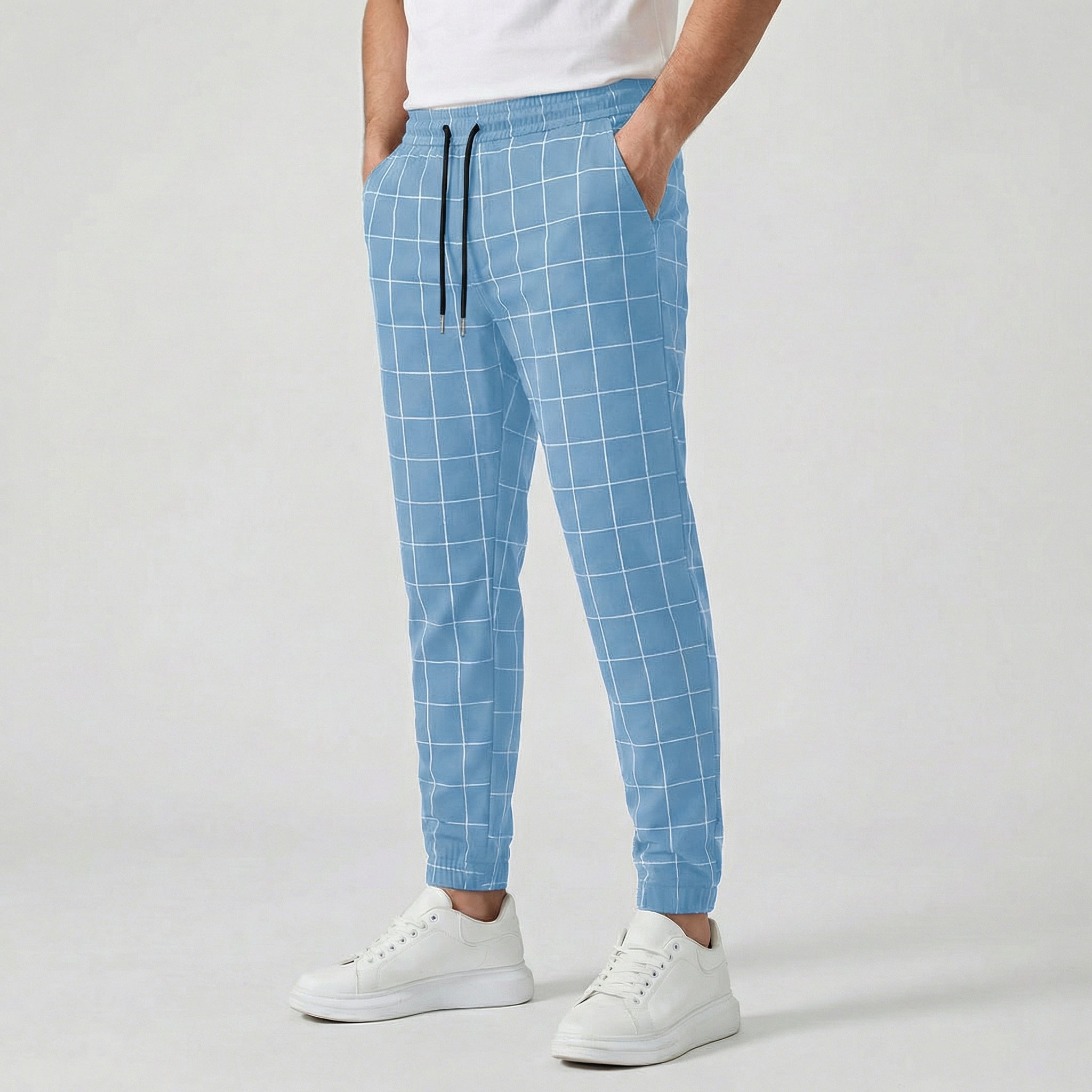 Pantaloni jogger uomo azzurri a quadri bianchi con vita elastica e caviglia stretta