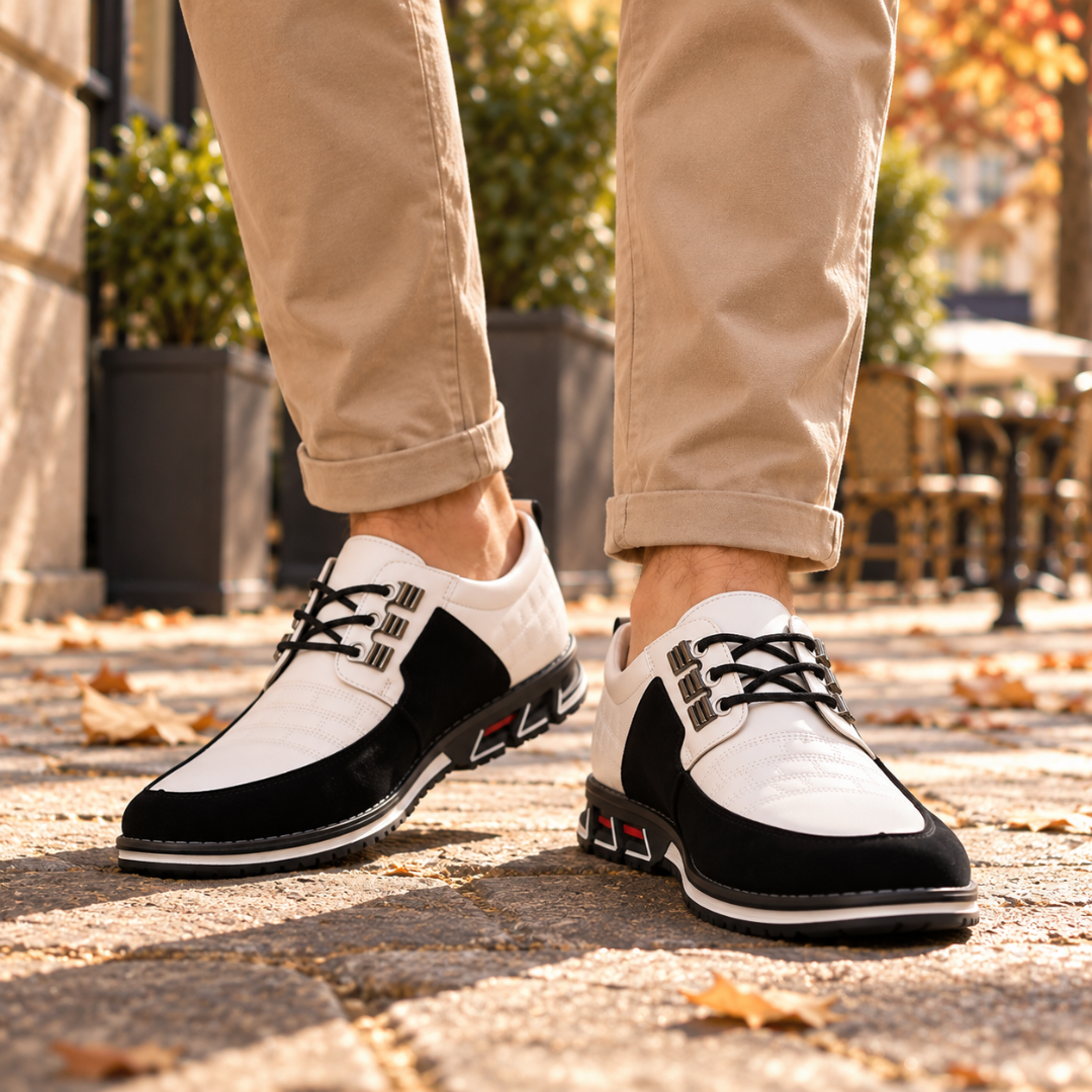 Scarpe basse uomo bianche con inserti neri e suola bianca, vista laterale