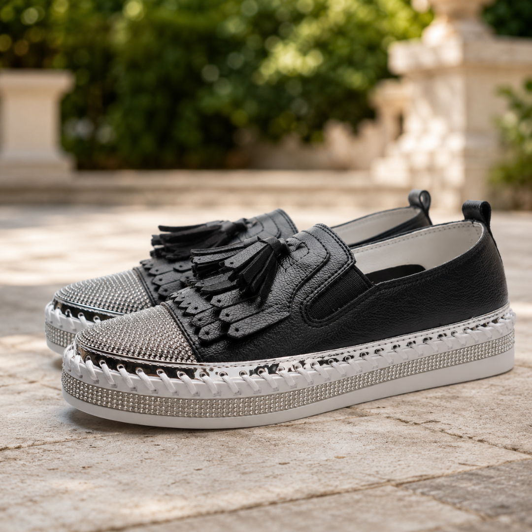 Sneakers donna nere di lato con inserto elastico e bordo di micro strass sulla suola
