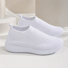 Sneakers donna slip on bianche traforate con bordo a coste e suola rigata