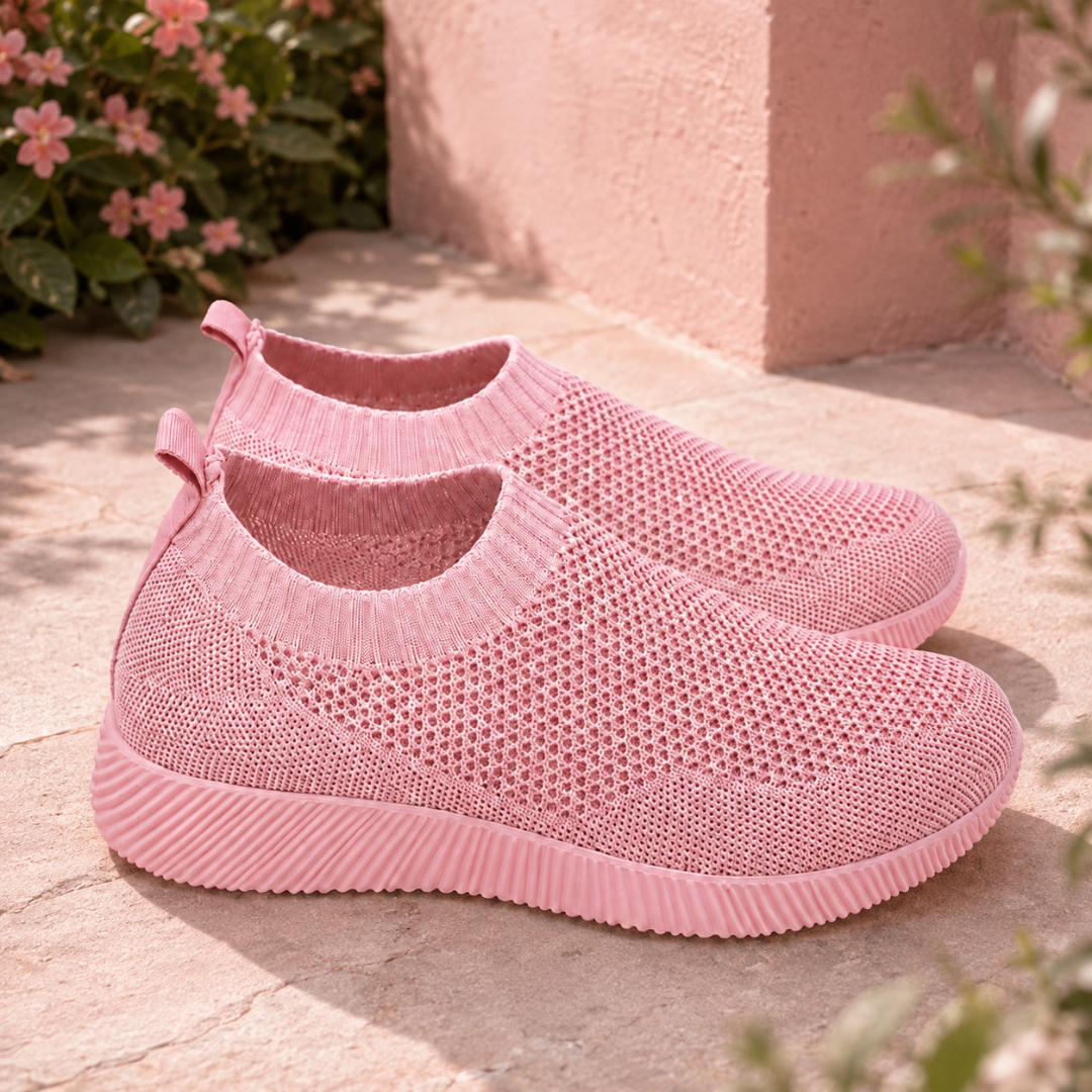 Sneakers donna rosa chiaro senza lacci con piccoli fori e linguetta posteriore