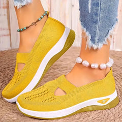 Sneakers gialle donna con aperture a goccia e suola a zeppa bassa in tinta