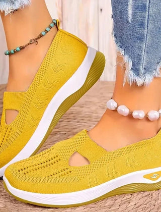 Sneakers gialle donna con aperture a goccia e suola a zeppa bassa in tinta