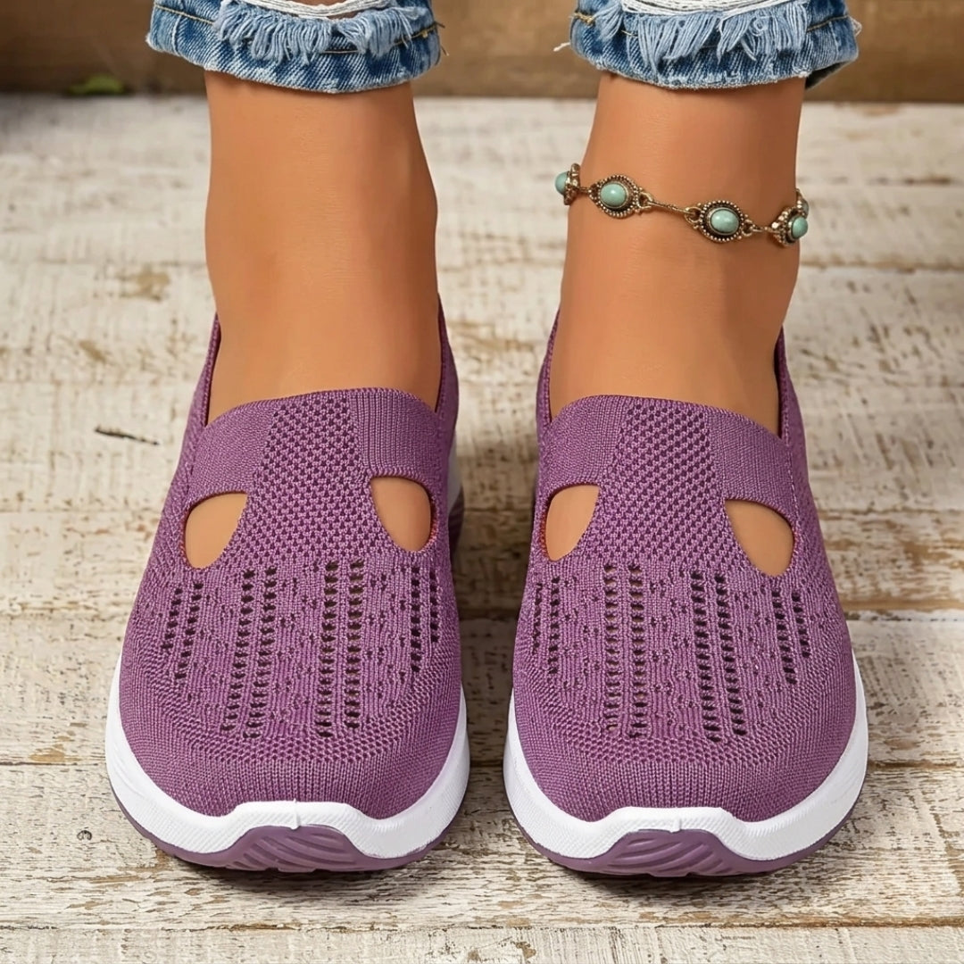 Sneakers donna viola slip-on viste frontalmente con aperture a goccia e suola bianca